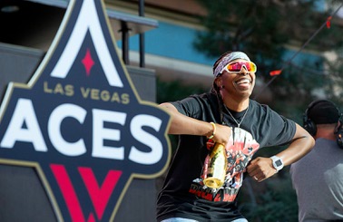 Las Vegas Aces guard Chelsea Gray poses onstage during the Las Vegas Aces championship celebration at Toshiba Plaza Monday, Oct. 23, 2023. The Aces became back-to-back WNBA national champions after beating the New York Liberty in Game 4 on Wednesday.
