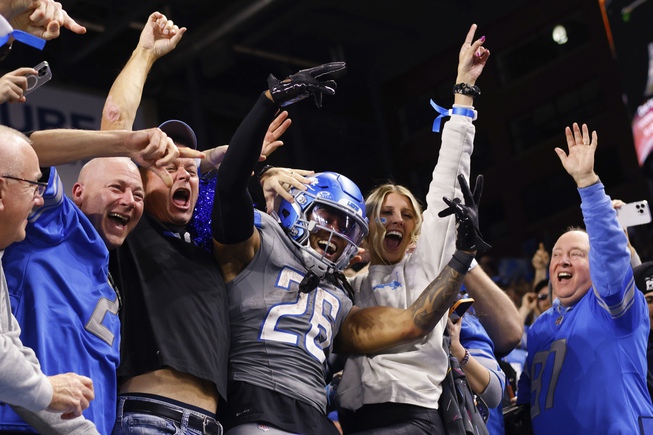 Detroit Lions running back Jahmyr Gibbs (26) celebrates with fans after scoring a touchdown against the Las Vegas Raiders in the second half at Ford Field in Detroit, Monday, Oct. 30, 2023. 



