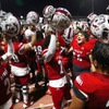 Liberty players celebrate after defeating Shadow Ridge 27-8 in a Class 5A-Division I state semifinal high school football game at Liberty High School Friday, Nov. 3, 2023, in Henderson.