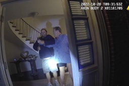 In this image taken from San Francisco Police Department body-camera video, the husband of former U.S. House Speaker Nancy Pelosi, Paul Pelosi, right, fights for control of a hammer with his assailant David DePape during a brutal attack in the couple's San Francisco home on Oct. 28, 2022.