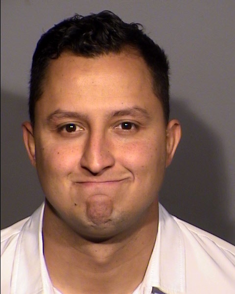 Metro Police officer Joseph Ortega is seen in a Clark County Detention Center booking photo, on Thursday, Nov. 16, 2023. Ortega was arrested on child abuse charges.