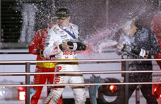 Race winner Max Verstappen, left, of the Netherlands, is doused with champagne on the winners podium during the inaugural Formula One Heineken Silver Las Vegas Grand Prix early Sunday morning, Nov. 19, 2023.