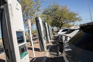 Various electric vehicles are seen charging at the Electrify America charging station in the Southern Premium Outlets parking lot, Tuesday Nov. 21, 2023.