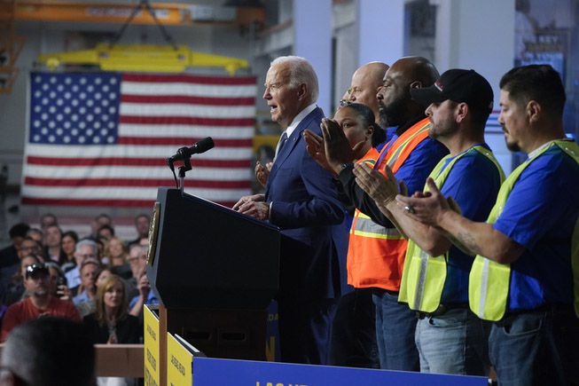 President Joe Biden speaks about investment in rail projects, including high-speed electric trains, Friday, Dec. 8, 2023, in Las Vegas.