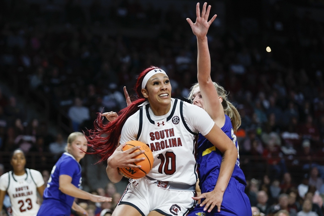 South Carolina center Kamilla Cardoso (10) looks to shoot against South Dakota State forward Brooklyn Meyer, right, during the first half of an NCAA college basketball game in Columbia, S.C., Monday, Nov. 20, 2023.