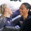 Kaillie Humphries and Kaysha Love of USA celebrate after their second run of the two-woman Bobsleigh World Cup race in Sigulda, Latvia, Sunday, Feb. 19, 2023. Love is moving from push athlete to driver for the U.S. and will make her World Cup debut as a pilot next month with hopes of moving closer to a spot in the 2026 Olympics. 