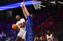 UNLV Rebels forward Keylan Boone (20) goes for a lay up against Creighton Bluejays center Ryan Kalkbrenner (11) during the second half of a college ...