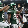 New York Jets running back Breece Hall (20) celebrates with wide receiver Xavier Gipson (82) after scoring a touchdown against the Houston Texans during the fourth quarter of an NFL football game, Sunday, Dec. 10, 2023, in East Rutherford, N.J.
