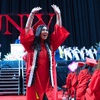 A graduate celebrates during a UNLV Winter commencement ceremony at the Thomas & Mack Center Tuesday, Dec. 19, 2023.