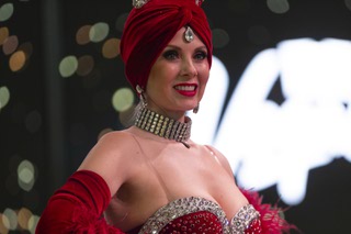 Las Vegas Convention and Visitors Authority showgirl Jennifer Autry stands on a stage during an event held to announce details for Americas Party 2024 at the Fashion Show Mall Wednesday, Dec. 20, 2023.