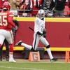Las Vegas Raiders cornerback Jack Jones scores after intercepting a pass and running it back for a touchdown as Kansas City Chiefs quarterback Patrick Mahomes (15) watches during the first half of an NFL football game Monday, Dec. 25, 2023, in Kansas City, Mo. 


