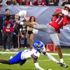UNLV wide receiver Ricky White makes a reception over Kansas cornerback Cobee Bryant (2) during the second half of the Guaranteed Rate Bowl NCAA college football game Tuesday, Dec. 26, 2023, in Phoenix. Kansas won 49-36.