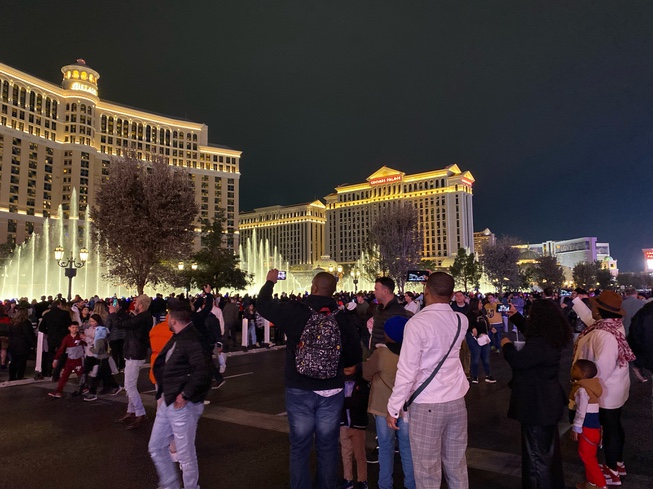 Visitors near the Bellagio on New Year's Eve, Dec. 31, 2023.