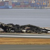 The burned out Japan Airlines plane is seen at Haneda airport on Wednesday, Jan. 3, 2024, in Tokyo, Japan. The large passenger plane and a Japanese coast guard aircraft collided on the runway at Tokyo's Haneda Airport on Tuesday and burst into flames, killing several people aboard the coast guard plane, officials said. 


