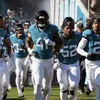 Jacksonville Jaguars players take the field during introductions before an NFL football game against the Carolina Panthers, Sunday, Dec. 31, 2023, in Jacksonville, Fla.