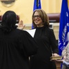 Barbara F. Schifalacqua, center, is sworn in as Henderson Justice Court, Justice of the Peace, Department III by hugs Alicia Albritton, Henderson Municipal Court Judge, Department I, during an investiture ceremony at Henderson City Hall Thursday, Jan. 18, 2024. Schifalacquas daughter Sophia, 11, and John, 8, stand at right and her husband Marc at left.