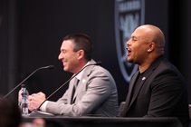 Raiders general manager Tom Telesco, left, smiles as head coach Antonio Pierce starts a Raiders chant during a news conference at Raiders Headquarters/Intermountain Health Performance ...