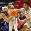Fresno State guard Isaiah Hill (3) and UNLV guard D.J. Thomas (11) chase after the ball during the first half of an NCAA basketball game Tuesday, Jan. 30, 2024, in Las Vegas.