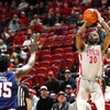 UNLV forward Keylan Boone (20) takes a shot over Fresno State center Eduardo Andre (35) during the second half of an NCAA basketball game at the Thomas & Mack Center Tuesday, Jan. 30, 2024.