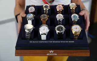 Abingdon Mullin, CEO and founder of Abingdon Co., holds a display of watches at the Abingdon watch store Wednesday, Jan. 31, 2024.