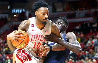 UNLV Rebels forward Kalib Boone (10) is fouled by Utah State Aggies forward Kalifa Sakho (34) during the second half of a NCAA basketball game at the Thomas & Mack Center Saturday, Jan. 13, 2024.
