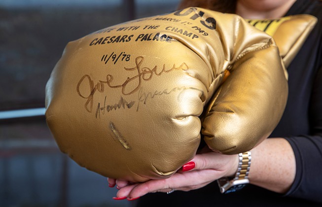 An oversized boxing glove, from “A Night with the Champ” on Nov. 9, 1978 and signed by boxer Joe Louis and then Las Vegas Sun publisher Hank Greenspun, is displayed in Brian Greenspun’s office Tuesday, Feb. 6, 2024.
