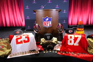 Counterfeit NFL merchandise is displayed during a news conference at Mandalay Bay Wednesday, Feb. 7, 2024. Officials warned consumers about buying counterfeit game-related merchandise