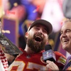 Kansas City Chiefs tight end Travis Kelce (87) celebrates while holding the Vince Lombardi Trophy after the NFL Super Bowl 58 football game against the San Francisco 49ers, Sunday, Feb. 11, 2024, in Las Vegas. The Chiefs won 25-22.