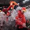 Kansas City Chiefs head coach Andy Reid is splashed after the NFL Super Bowl 58 football game against the San Francisco 49ers, Sunday, Feb. 11, 2024, in Las Vegas. The Chiefs won 25-22.