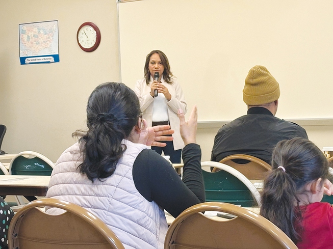 Las Vegas immigration attorney Adriana Pereyra leads a workshop Thursday, Feb. 22, 2024, for nearly two dozen immigrants and their families about how to avoid falling victim to predatory behavior.