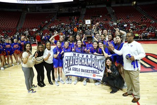 Bishop Gorman players and coaches pose after defeating Centennial, 57-53, to win the girls Class 5A state basketball championship at the Thomas & Mack Center Friday, Feb. 23, 2024.