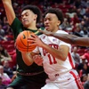 UNLV Rebels guard D.J. Thomas (11) is fouled as he drives to the basket between Colorado State Rams guards Jalen Lake (15) and Isaiah Stevens (4) during the first half of an NCAA basketball game at the Thomas & Mack Center Saturday, Feb. 24, 2024.