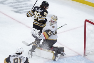 Boston Bruins right wing David Pastrnak (88) collides with Vegas Golden Knights goaltender Adin Hill (33) in the first period Thursday, Feb. 29, 2024, in Boston. 


