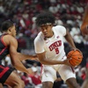 UNLV guard Rob Whaley Jr. (5) controls the ball against San Diego State guard Brooklyn Hicks (13) during the first half of an NCAA college basketball game Tuesday, March 5, 2024, in Las Vegas.