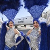 Showgirls pose for a photo as Porter Airlines’ inaugural flight between Toronto, Canada and Las Vegas arrives at Harry Reid International Airport Tuesday, March 5, 2024.