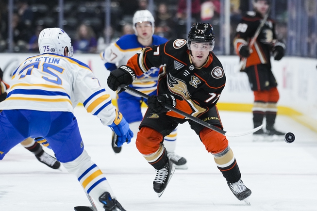 Anaheim Ducks right wing Frank Vatrano, right, clears the puck past Buffalo Sabres defenseman Connor Clifton during the first period Tuesday, Jan. 23, 2024, in Anaheim, Calif. 


