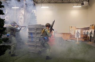 Metro Police instructors John Shevlin, left, and Spencer O’Roarke demonstrate a shooting and first aid training simulation during a news conference at the Joint Emergency Training Institute Wednesday, March 6, 2024.