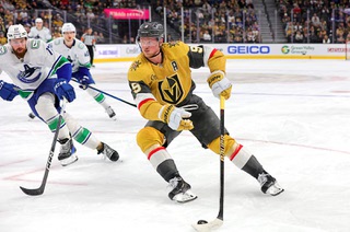 Vegas Golden Knights center Jack Eichel (9) skates against Vancouver Canucks defenseman Filip Hronek (17) during the third period of an NHL hockey game at T-Mobile Arena Thursday, March 7, 2024.