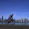 A cyclist travels around Lake Michigan near the Adler Planetarium Monday, Feb. 26, 2024, in Chicago.