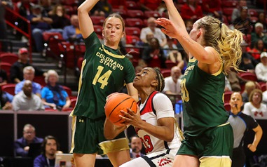 UNLV Lady Rebels guard Amarachi Kimpson (33) drives to the basket between Colorado State Rams guards Marta Leimane (14) and Hannah Ronsiek (30) in the second half of an NCAA women’s semifinal game during the Mountain West Championships at the Thomas & Mack Center Tuesday, March 12, 2024.