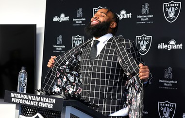 Christian Wilkins, a 6-4, 310-pound defensive tackle, displays a jacket with a playing card design in the liner during a news conference at the Intermountain Health Performance Center/Raiders Headquarters in Henderson Thursday, March 14, 2024. Wilkins joins the Raiders after spending the last five seasons with the Miami Dolphins.