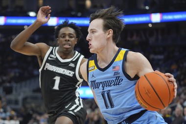 Marquette’s Tyler Kolek drives past Providence’s Jayden Pierre during the first half of an NCAA college basketball game Wednesday, Feb. 28, 2024, in Milwaukee.