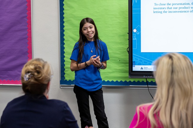 Angeline, a fifth grade student at Fay Herron Elementary School, pitches a business idea for a new dog feeding bowl with her team to a panel of “investors” in the style of Shark Tank, Thursday March 21, 2024. This city-wide competition called Swimming with the Big Fish is sponsored by Junior Achievement of Southern Nevada and will award 3 finalists with scholarships during a final round at Fontainebleau.
