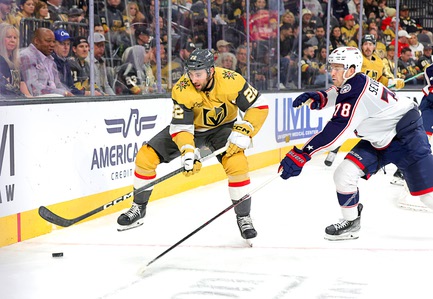 Vegas Golden Knights right wing Michael Amadio (22) and Columbus Blue Jackets defenseman Damon Severson (78) chase after the puck during the third period of an NHL hockey game at T-Mobile Arena Saturday, March 23, 2024.