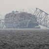 A container ship rests against the wreckage of the Francis Scott Key Bridge on Thursday, March 28, 2024, in Baltimore, Md. 