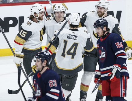Vegas Golden Knights' Noah Hanifin (15), Pavel Dorofeyev, Nicolas Hague (14) and Anthony Mantha celebrate Dorofeyev's goal against the Winnipeg Jets during the first period in Winnipeg, Manitoba, on Thursday, March 28, 2024. 


