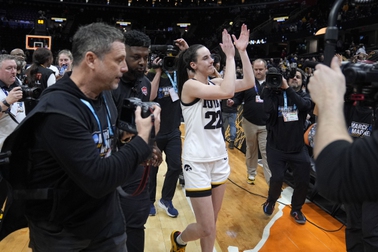 Iowa guard Caitlin Clark (22) walks off the court after a Final Four college basketball game against UConn in the women's NCAA Tournament, Friday, April 5, 2024, in Cleveland. Iowa won 71-69.