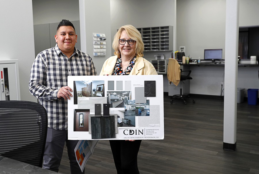 Cory Frank, vice president of business development and project management for Nigro Construction Inc., and Melissa Katz, CCO for the Comprehensive Digestive Institute of Nevada, pose with a finish board in a nurses’ station in the Saint Rose Parkway office in Henderson Friday, April 5, 2024. Nigro Construction converted the building from a financial services company to an office for the Comprehensive Digestive Institute.