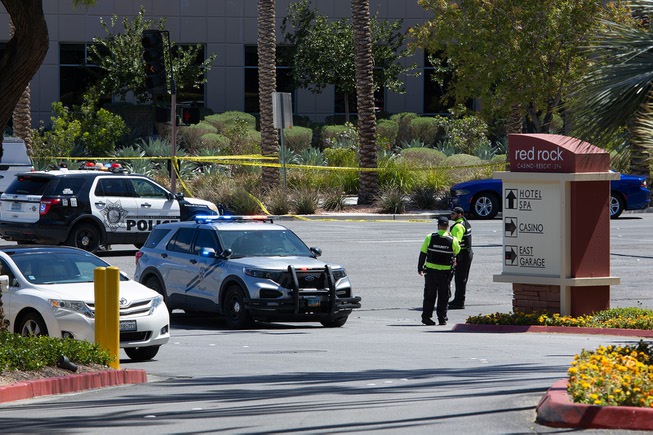 Police and emergency response crews work the scene of a shooting that occurred at a law office near Red Rock Resort & Casino that left 3 dead, Monday April 8, 2024.