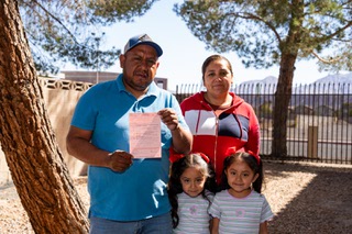 Humberto and Mariana, who requested their last names be left out of the story, stand with their twin daughters and a citation received while they sold mexican street snacks near the Richard J. Rundle elementary school off Riata Way and Copper Road. It’s the first citation they’ve received in nine years of vending, and more restrictions are coming for southern Nevada’s street vendors, on Monday, April 10, 2024. 